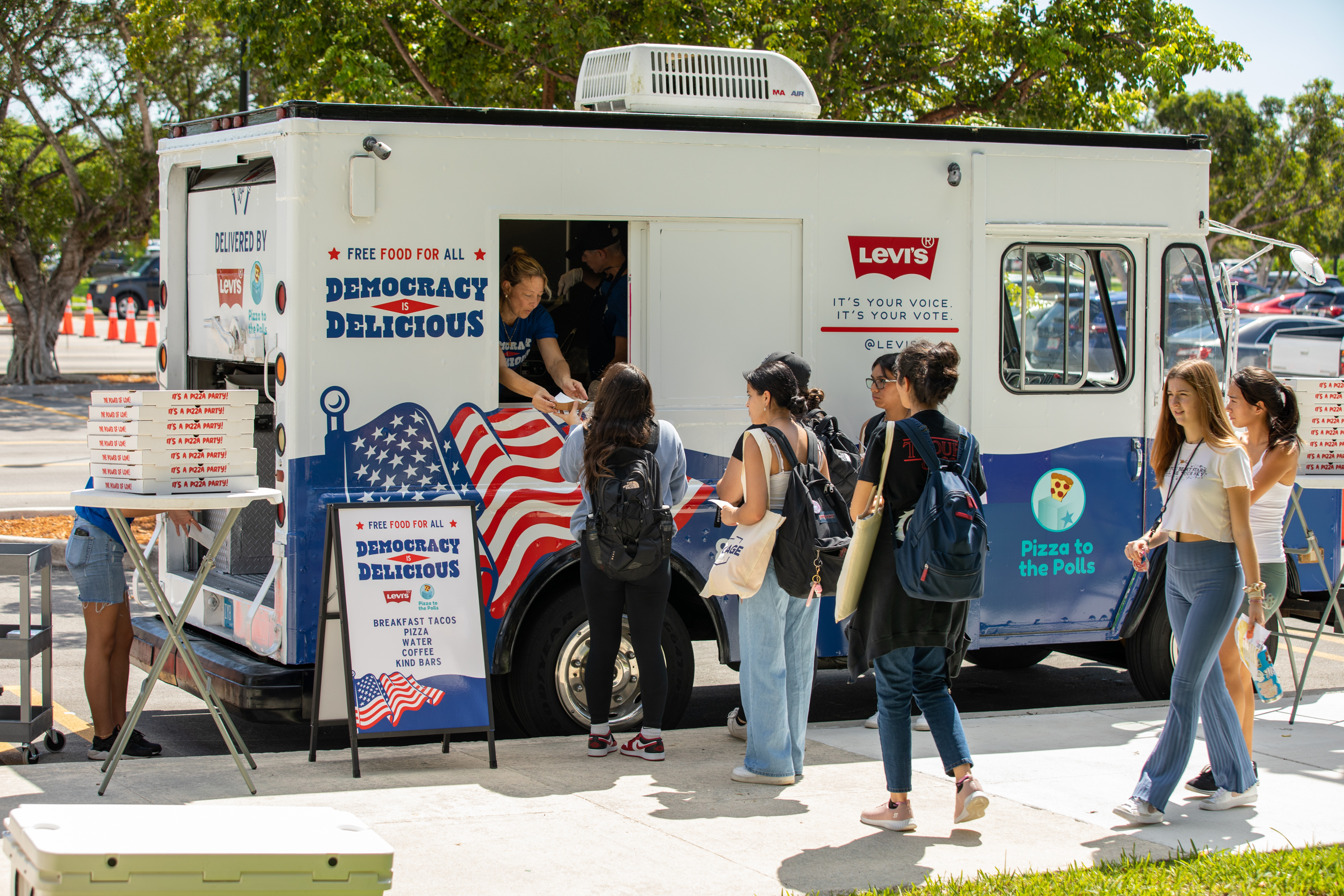 Levi's co-branded Pizza to the Polls food truck on a college campus with students lined up